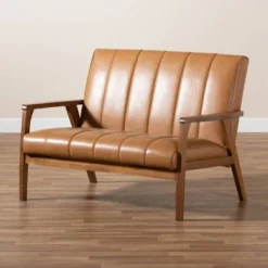 Nikko Mid-Century Faux Leather Upholstered Wood Loveseat Walnut/Brown - Baxton Studio 15 Nikko Mid-Century Faux Leather Upholstered Wood Loveseat Walnut/Brown - Baxton Studio -Lush Living Store GUEST 523a5df4 2552 4576 a2e6 22ac3329118d