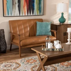 Nikko Mid-Century Faux Leather Upholstered Wood Loveseat Walnut/Brown - Baxton Studio 14 Nikko Mid-Century Faux Leather Upholstered Wood Loveseat Walnut/Brown - Baxton Studio -Lush Living Store GUEST d1496ae9 9e7b 4c99 a39c b224c1b080f8